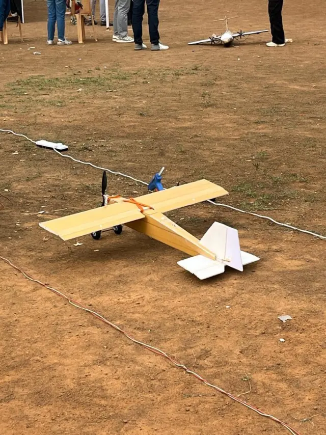 The finished foam RC plane on the floor, wings and tail fitted